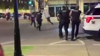 Not-so-smart black guy opens fire at crowd in front of cops, is immediately Shot by the Cops. Tulsa, Oklahoma, USA
