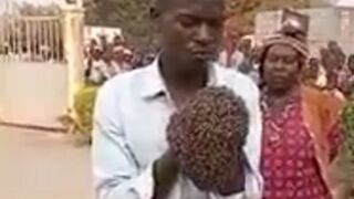 Creepy: "African witch" in Uganda arrested a motorcycle thief with Handcuffs of Bees
