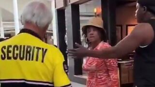 Woman slaps an elderly security man and tells him to not touch her