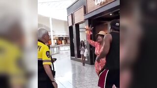 Woman slaps an elderly security man and tells him to not touch her