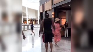 Woman slaps an elderly security man and tells him to not touch her