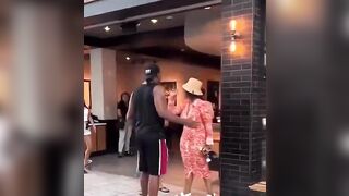 Woman slaps an elderly security man and tells him to not touch her