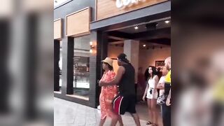 Woman slaps an elderly security man and tells him to not touch her