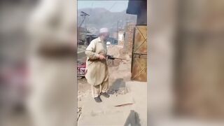 Pakistani old man preparing his weapon for the war