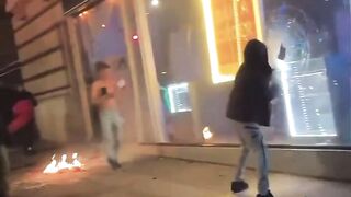 Paris, Beautiful Paris. Car tries to make it through Protestors