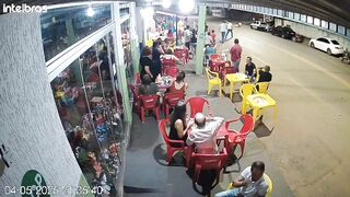 Pretty Girl arriving at the Bar using her Cell phone while Crossing the Street. Watch Road (Slow Motion Added)