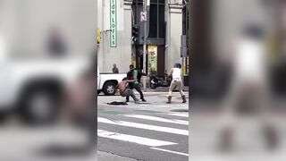 Woman Smashes Dude over the Head with a Chair WWE-style in Downtown LA. LOL