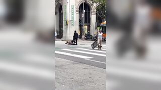 Woman Smashes Dude over the Head with a Chair WWE-style in Downtown LA. LOL