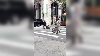 Woman Smashes Dude over the Head with a Chair WWE-style in Downtown LA. LOL