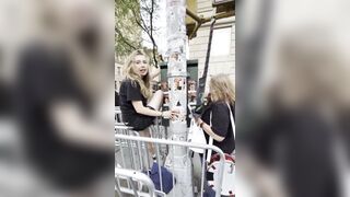 Two women LAUGH as they rip down posters of kidnapped Israelis in New York.