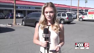 A black drug addict runs up touching her begging for $1 on live TV.