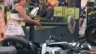 The Craziest Girl stuffs Noddles in Exhaust of Cycle
