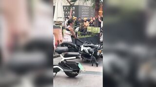 The Craziest Girl stuffs Noddles in Exhaust of Cycle