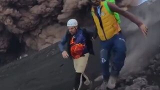 Tourists and guides run for their lives when Mount Etna suddenly erupts