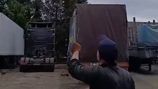 Drunk local truck drivers laugh and panic as drone nearly hits them