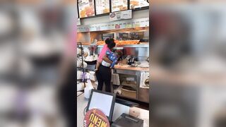 Woman holding her Baby helps Herself to the Chicken. Pay? nah