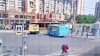 Woman on the Phone ends up in Wheels of a Bike