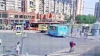 Woman on the Phone ends up in Wheels of a Bike