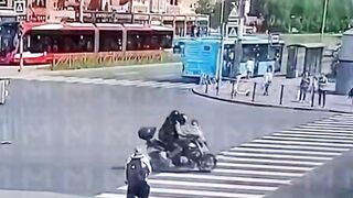 Woman on the Phone ends up in Wheels of a Bike