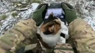 Ukrainian soldier gets a helper while he's controlling a drone