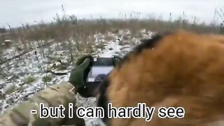 Ukrainian soldier gets a helper while he's controlling a drone