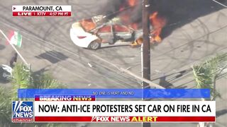 This LA,USA last night. Man on Live TV circles Burning Car waving the Mexican Flag