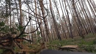 Russian soldiers cutting the fiber optic cable of a Ukrainian drone.