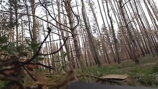 Russian soldiers cutting the fiber optic cable of a Ukrainian drone.