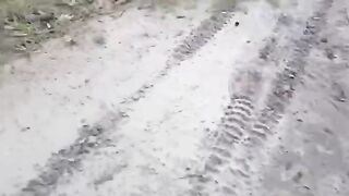 Russian soldiers cutting the fiber optic cable of a Ukrainian drone.