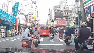 Taiwan: Watch the poor guy riding with his girl.