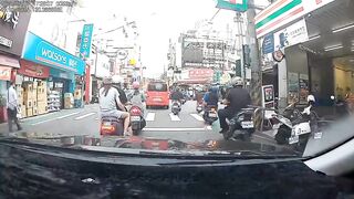Taiwan: Watch the poor guy riding with his girl.