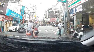 Taiwan: Watch the poor guy riding with his girl.