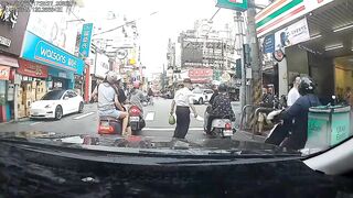 Taiwan: Watch the poor guy riding with his girl.