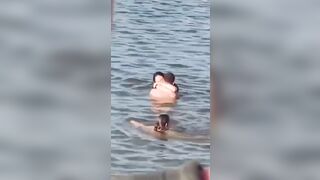 Lovebirds engage in debauchery in the water right next to swimming families