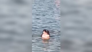 Lovebirds engage in debauchery in the water right next to swimming families