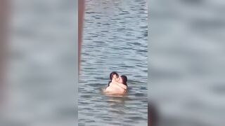 Lovebirds engage in debauchery in the water right next to swimming families