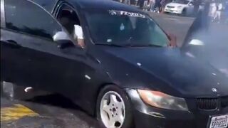 Protestor in LA thrown Explosive at BMW and Blow off the Fingers of the Driver