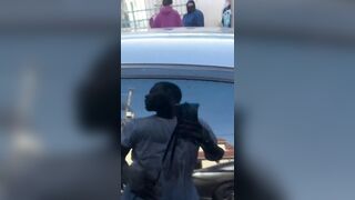 Protestor in LA thrown Explosive at BMW and Blow off the Fingers of the Driver