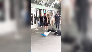 Many men film and watch without helping the woman attacked by usual suspect. Intolerable.