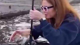 Kitten Drowning in Canal is Rescued by Woman and her Umbrella