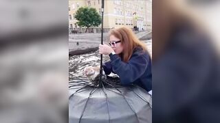 Kitten Drowning in Canal is Rescued by Woman and her Umbrella