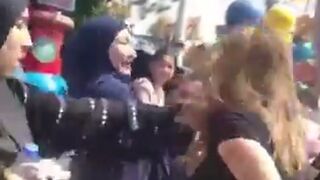 Woman without hijab attacked by Muslim mob.