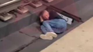 Man fell asleep on the Subway Train Tracks..