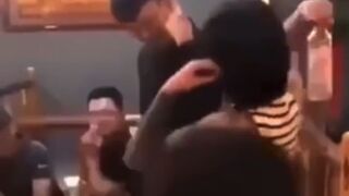 Woman hits man with bottle, see what happens next
