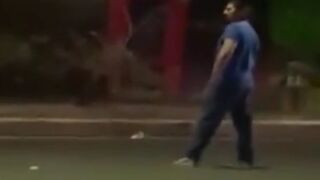 Fat guy figures he can take on a car, but didn't stop to consider weight ratios
