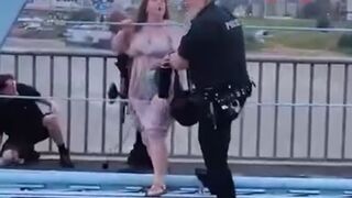 In the US, a cop beat up liberals who blocked a road protesting the actions of the Immigration Service.