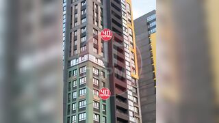 A man parachuted from a balcony.