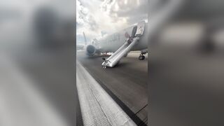 Panic: Passengers forced to Evacuate Plane onto Denver runway after landing gear issue sparked fire