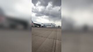 Panic: Passengers forced to Evacuate Plane onto Denver runway after landing gear issue sparked fire