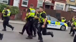 When British police fled chased by angry immigrants. Memorable scene.